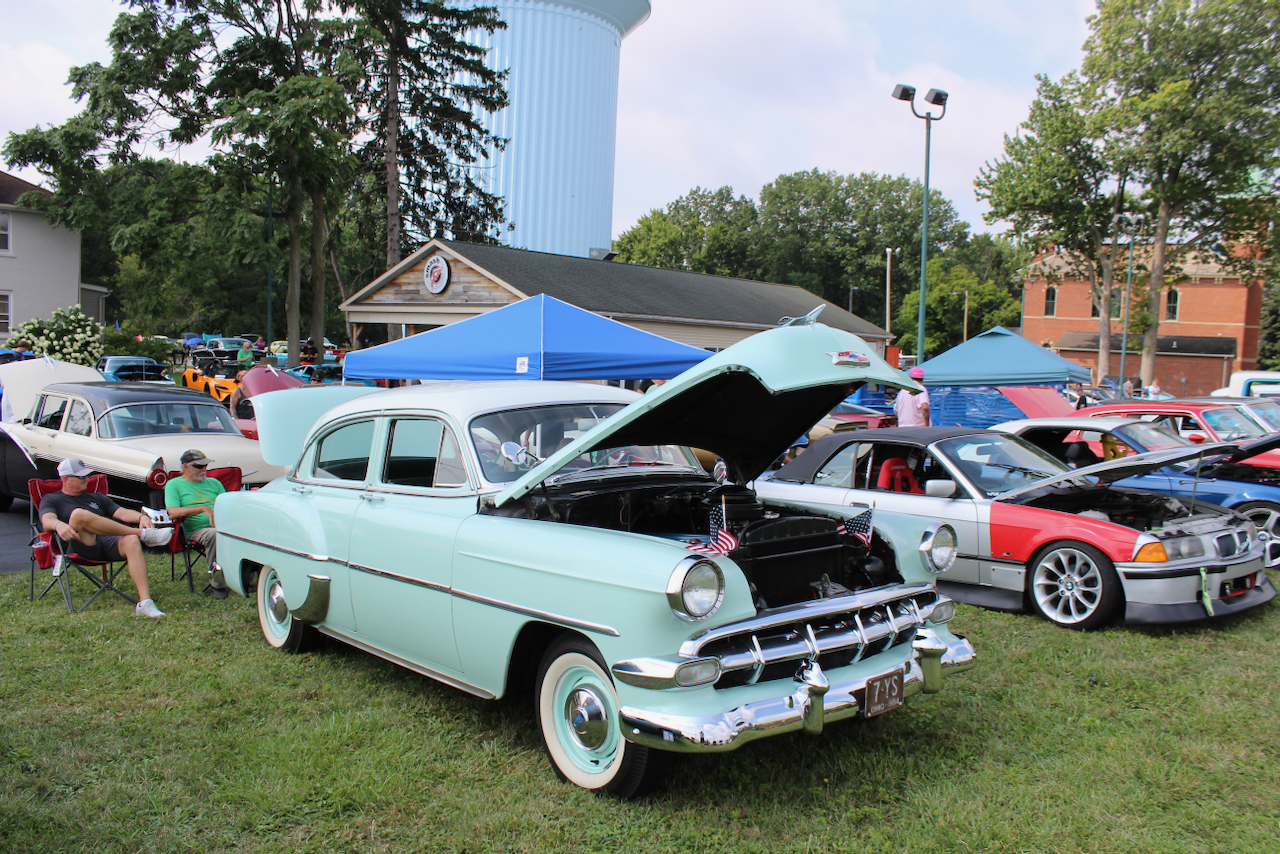1950s Chevrolet sedan, mint green and white, hood open front three-quarter view