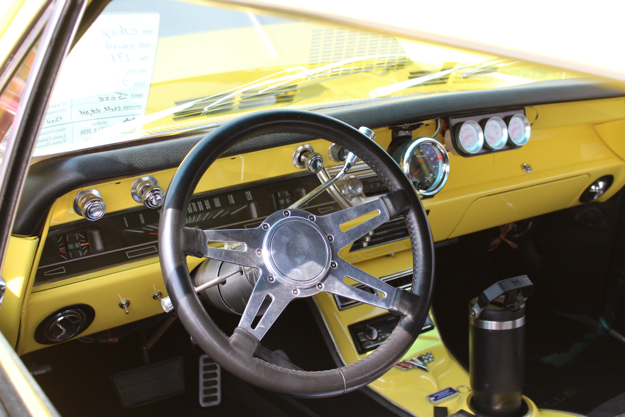 1960s Chevrolet muscle car, yellow interior, dashboard and gauges view