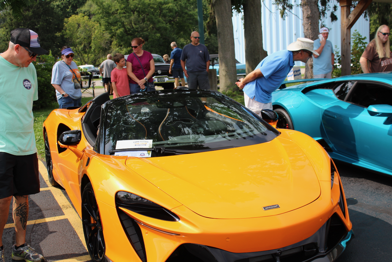 2020s McLaren supercar, orange, front three-quarter view