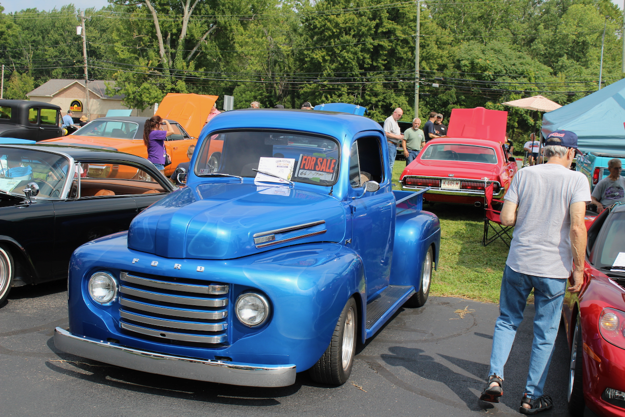 1940s Ford pickup, blue, front three-quarter view with for-sale sign