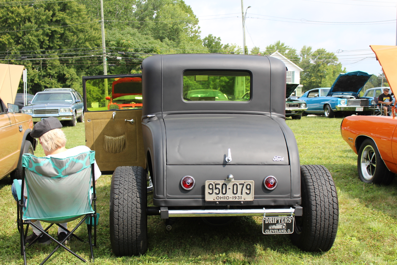 1930s Ford-style hot rod coupe, matte black, rear view