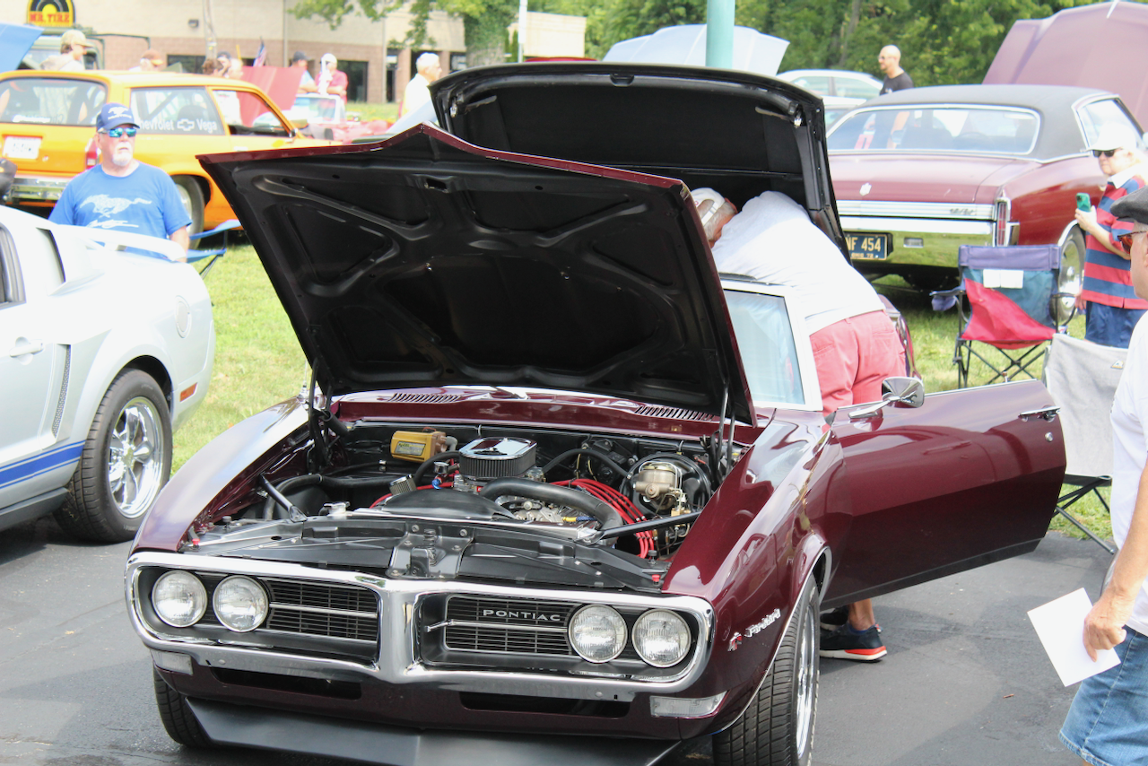 1960s Pontiac Firebird convertible, burgundy, hood open front view