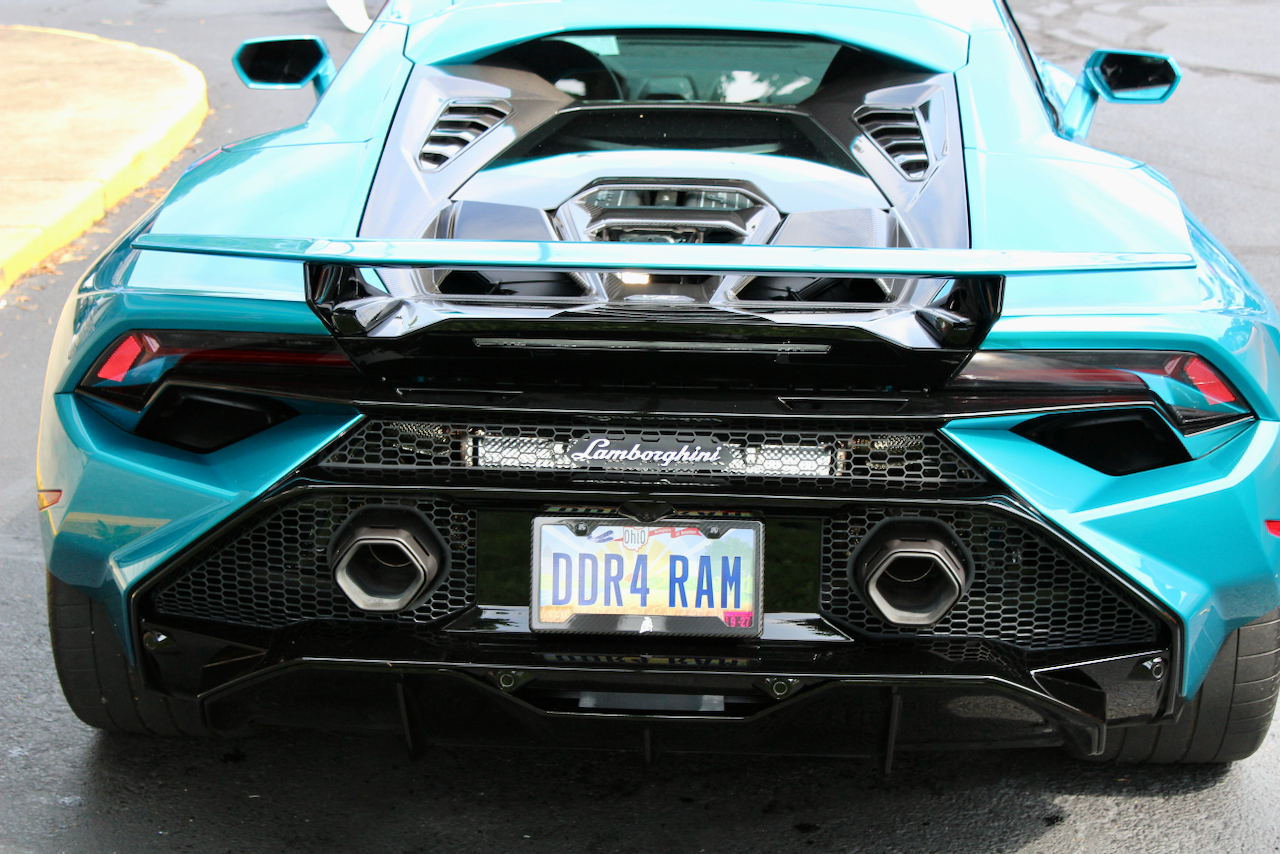 2020s Lamborghini Huracan, turquoise, rear view with wing